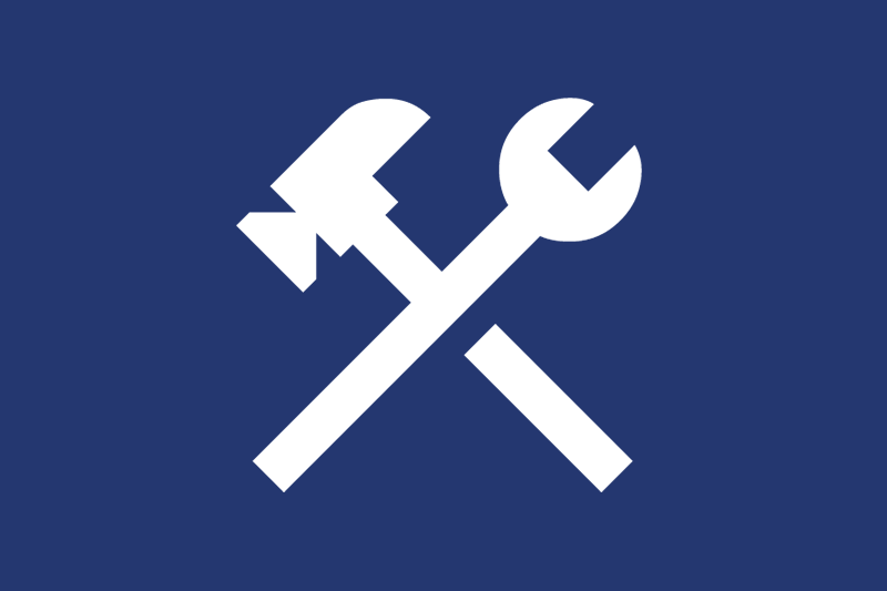 White hammer and wrench icon on a blue background