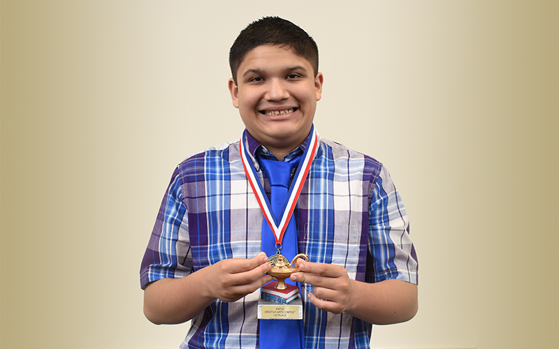 Photo: Christopher Garcia of Uvalde displays his award during the 37th Annual Creative Arts Ceremony in Uvalde